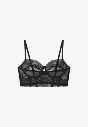 Black lace longline bra with floral embroidery, underwire cups, and adjustable thin shoulder straps on a white background.
