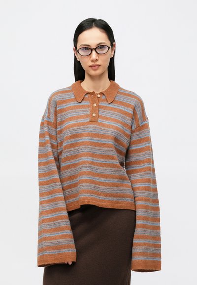 Striped sweater in rust and blue hues, made from soft knit material. Features a polo collar and four button placket, with oversized sleeves.