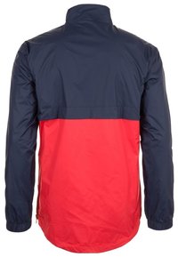 Water-resistant jacket featuring a navy blue upper section and bright red lower section. Long sleeves with elastic cuffs, lightweight texture.