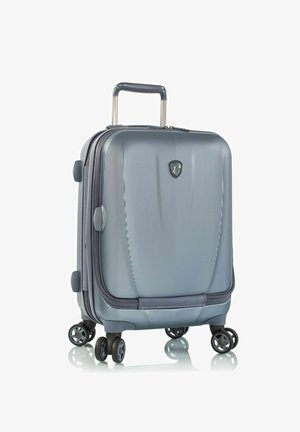 Hartschalenkoffer in Schiefergrau mit strukturierter Oberfläche, vier drehbaren Rollen und einem ausziehbaren Griff für einfachen Transport.