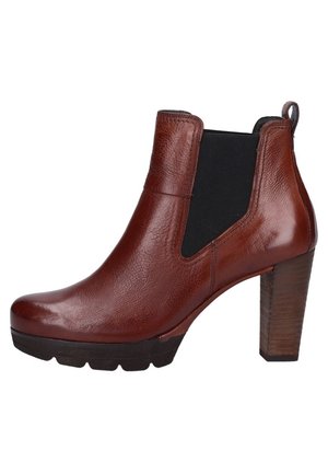 Brown leather ankle boot with elastic panels, high wooden heel, smooth texture, and rounded toe. Durable sole with slight tread.