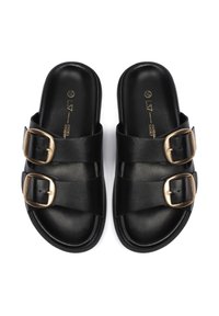 Black leather sandals featuring two wide straps, each with a gold-tone buckle accent. Smooth texture and slip-on design.