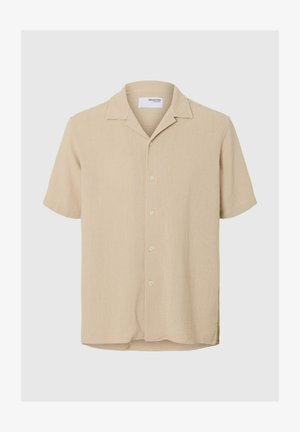 Beige kortärmad skjorta med knappframsida, strukturerad tyg och klassisk krage. Har fem knappar och sidoklyftor i fållen.