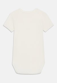 Λευκός, μονόχρωμος βρεφικός κορσές με κοντά μανίκια και στρογγυλή λαιμόκοψη, εμφανιζόμενος από πίσω πάνω σε λευκό φόντο.