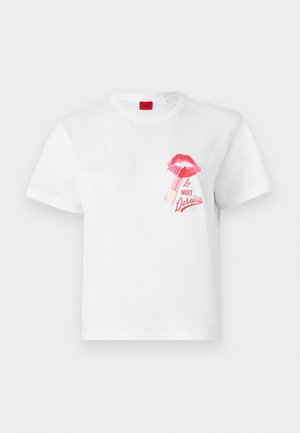White cotton t-shirt with short sleeves, featuring a pink lip print and a lipstick graphic, along with the text "La Nuit Devious."