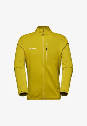 Chaqueta amarilla con cremallera, de superficie texturizada, con cremallera de media longitud, bolsillo lateral y detalles de costura en contraste.