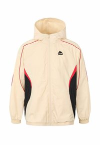 Cremefarvet hættejakke med røde og sorte accenter, med lynlås foran, elastiske manchetter og sidepaneler for et sporty design. Kappa-logo vist.