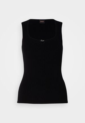 Top in cotone nero a costine con scollatura quadrata, caratterizzato da un piccolo logo al centro. Realizzato in un morbido materiale testurizzato.