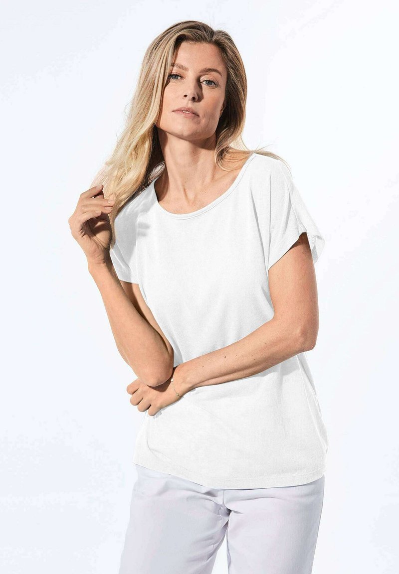 Wit, T-shirt met korte mouwen en een ontspannen pasvorm en ronde hals. Lichtgewicht stof, soepel textuur en subtiele stikseldetails.