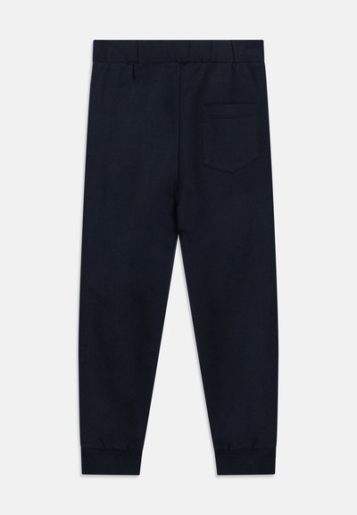 Námornícke jogger nohavice vyrobené z mäkkej látky, s elastickým pásom, manžetovými lemami a jednou zadnou vreckom s jemným stehom.