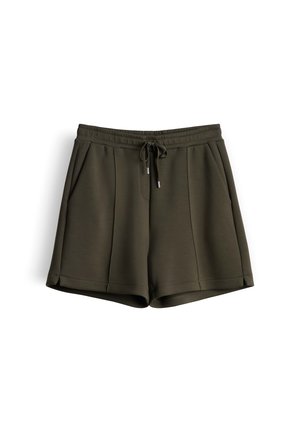 Pantaloncini casual verde scuro con vita elastica, coulisse frontale, tasche laterali e cuciture verticali imbastite su sfondo bianco.