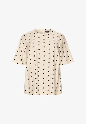 Krémová blúzka s krátkym rukávom s čiernymi bodkami, okrúhlym výstrihom a zapínaním na gombík so zarážkou vzadu.