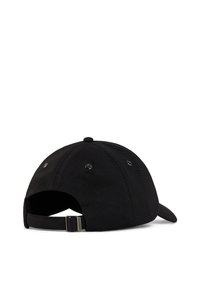Black cap with a curved brim, made of textured fabric. Features ventilation eyelets and an adjustable strap at the back.