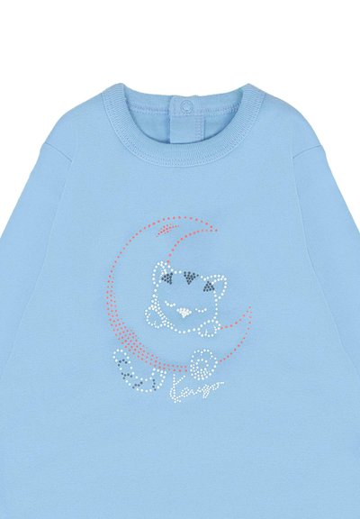 Felpa azzurra con scollatura rotonda, decorata con una grafica di un gatto e un design di luna realizzato con strass colorati. Chiusura a bottone sul retro.