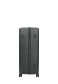 Black hard-shell suitcase with a textured surface, double zipper closure, two small side handles, and four wheels for mobility.