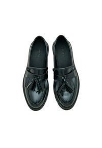 Zwarte leren loafers met een gladde afwerking, decoratieve kwastjes en een gestikte zool. Rond neuzen en platte hakontwerp.