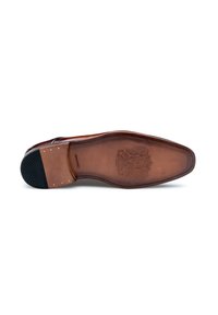 Semelle de chaussure en cuir avec une finition lisse couleur tan, dotée d'un talon en caoutchouc noir texturé et de détails en relief. Bords cousus pour une durabilité accrue.