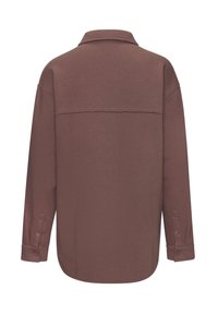 Long-sleeve shirt in brown, featuring a collared neck, buttoned cuffs, and a seamless back design with a soft, textured fabric.