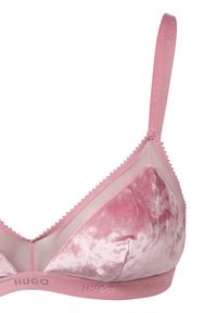 Pink velvet bralette with sheer mesh elements, elastic band featuring "HUGO" logo, smooth texture, and triangular cup shape.