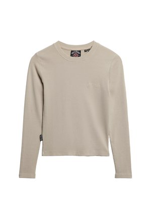 Beige langærmet ribstrikket skjorte med rund hals og subtilt logo på brystet. Har en lige kant og et mærke på sidesømmen.