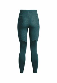 Höga teal leggings tillverkade av stretchmaterial med ett strukturerat blommönster, med perforerade detaljer på de nedre delarna av benen.