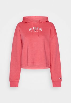 Koraalroze cropped hoodie met vooraan witte tekst "Tommy Jeans" en New York City, verstelbare capuchonkoorden en geribbelde manchetten met klein logoplaatje.