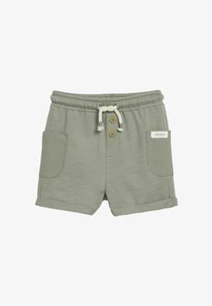 Hellgrüne Kinder-Shorts mit elastischem Bund, weißem Kordelzug, zwei Fronttaschen, zwei Holzknöpfen und einem "newbie" Etikett auf der rechten Tasche.