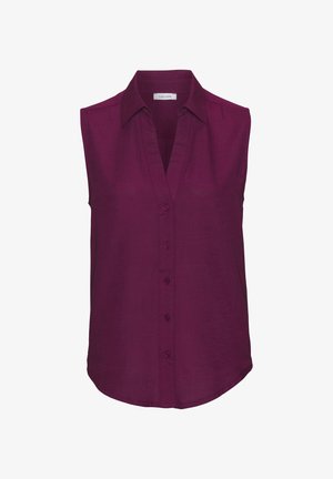 Sleeveless blouse in dark purple fabric with a V-neck, button closure, and curved hem; smooth texture with a clean, simple design.