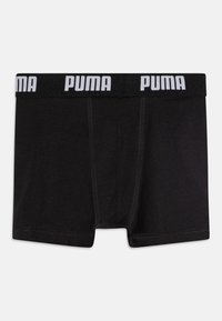 Črne bokserice iz mehke tkanine z belim logotipom PUMA na elastičnem pasu. Imajo standardno zasnovo in ravne šive.