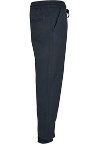 Pantalon de jogging homme bleu marine foncé avec taille élastique, cordon de serrage, poches latérales et arrière, et poignets élastiques aux chevilles.