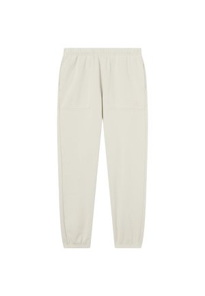 Beige Jogginghosen mit elastischem Bund, vorderen aufgesetzten Taschen, seitlichen Taschen und elastischen Bündchen, schlicht mit dezentem Logo auf der linken Tasche.
