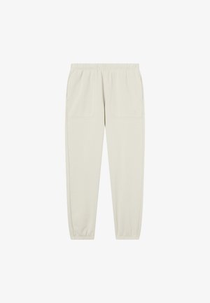 Pantaloni jogger beige con cintura elasticizzata, tasche frontali a toppa, tasche laterali e polsini elasticizzati, semplici con un logo discreto sulla tasca sinistra.