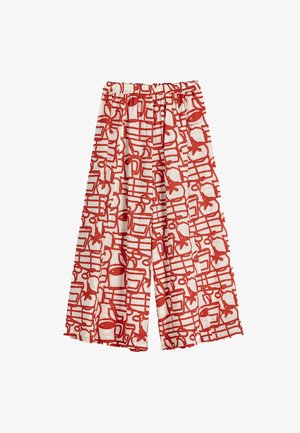 Wijde broek met elastische tailleband, voorzien van een gedurfd rood abstract patroon op witte stof.