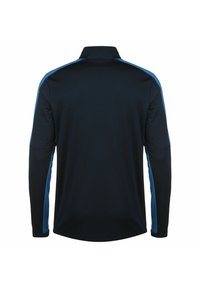 Langärmliges Poloshirt in Marineblau mit hellblauen Seitenteilen, ausgestattet mit einem flachen Kragen und einem abgerundeten Saum. Glatte Stoffoberfläche.