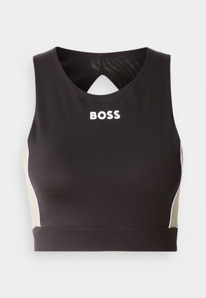 Black athletic crop top with a keyhole back, featuring white "BOSS" lettering and beige side accents. Made from stretchy, smooth fabric.