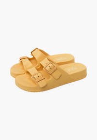 Yellow rubber sandals with two adjustable straps, textured surface, and a cushioned footbed, featuring a sturdy grip sole.