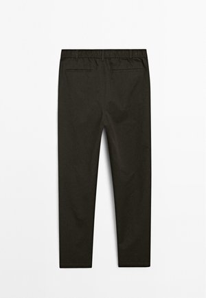 Dark brown trousers with a tapered leg, featuring an elastic waistband and two back pockets, displayed against a white background.