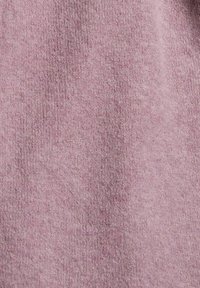 Mjuk stickad tygtextur i dämpad rosa färg med synliga fina fibrer och subtilt vävnad mönster.