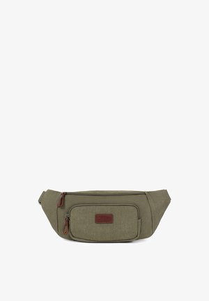 Sac banane en toile vert olive avec deux compartiments zippés et tirettes en cuir marron, conçu pour être porté sans les mains.