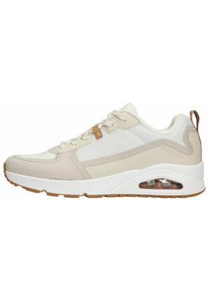 Skechers sneakers in beige and cream with mesh and suede materials. Features air-cushioned sole, laces, and a tan accent detail.