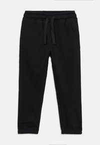 Zwarte sweatpants met een elastische tailleband en trekkoord, met een gladde textuur en taps toelopende pijpen, zonder zichtbare patronen of hardware.