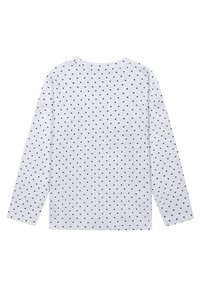 T-shirt à manches longues en tissu blanc avec un motif à pois noirs, col rond et coupe décontractée.