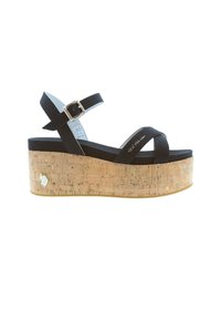 Sandalias de plataforma negras con suela de cuña de corcho. Tira ajustable en el tobillo y diseño de bandas cruzadas. Textura suave con detalle de hebilla plateada brillante.