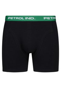 Svarta bomullshorts med grön midja som har texten "PETROL IND." och kontrasterande sömmar. Slät textur med en åtsittande passform.