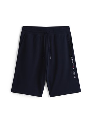 Mørkeblå shorts laget av mykt stoff, med elastisk liv med snor og sidelommer; "TOMMY HILFIGER"-logo langs siden.