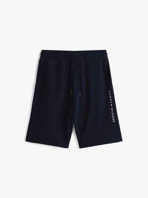Navy blue sweat shorts made of soft fabric, featuring an elastic waistband with drawstring and side pockets; "TOMMY HILFIGER" logo along the side.