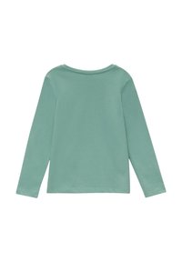 Chemise à manches longues de couleur vert menthe douce, fabriquée en coton léger. Elle présente un col rond et un design sobre.