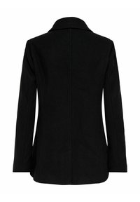 Mustapuhvainen villakangastakki, jossa on lovettu kaulus, pitkät hihat ja suora leikkaus. Takissa on sauman yksityiskohta, joka kulkee alas selässä.