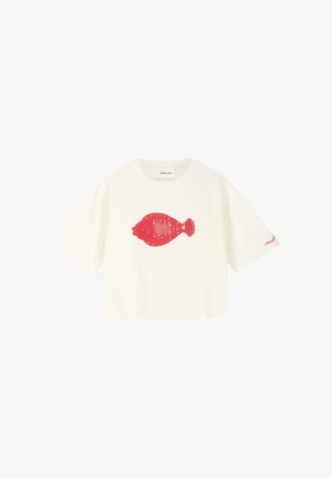 White short-sleeve crop top with round neck and red lace fish design centered on the front, small red text on left sleeve hem.