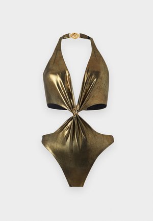 Maillot de bain une pièce en or métallique avec un col halter, détail de nœud à l'avant et une boucle ronde en or au niveau du cou.
